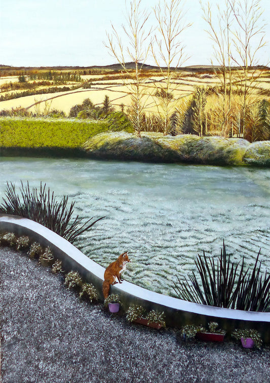 Fox on a wall overlooking a frosted grass garden with trees and fields in the background